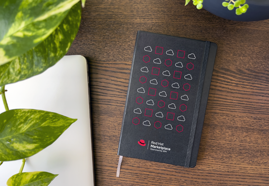 A notebook with an icon pattern printed on the front cover.