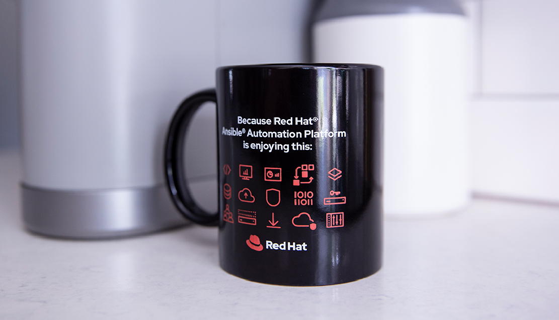 Red icons related to automation printed on a black mug.