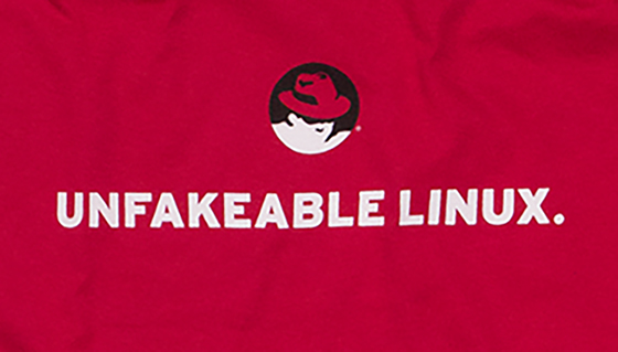 Red t-shirt with Shadowman and the text Unfakeable Linux.